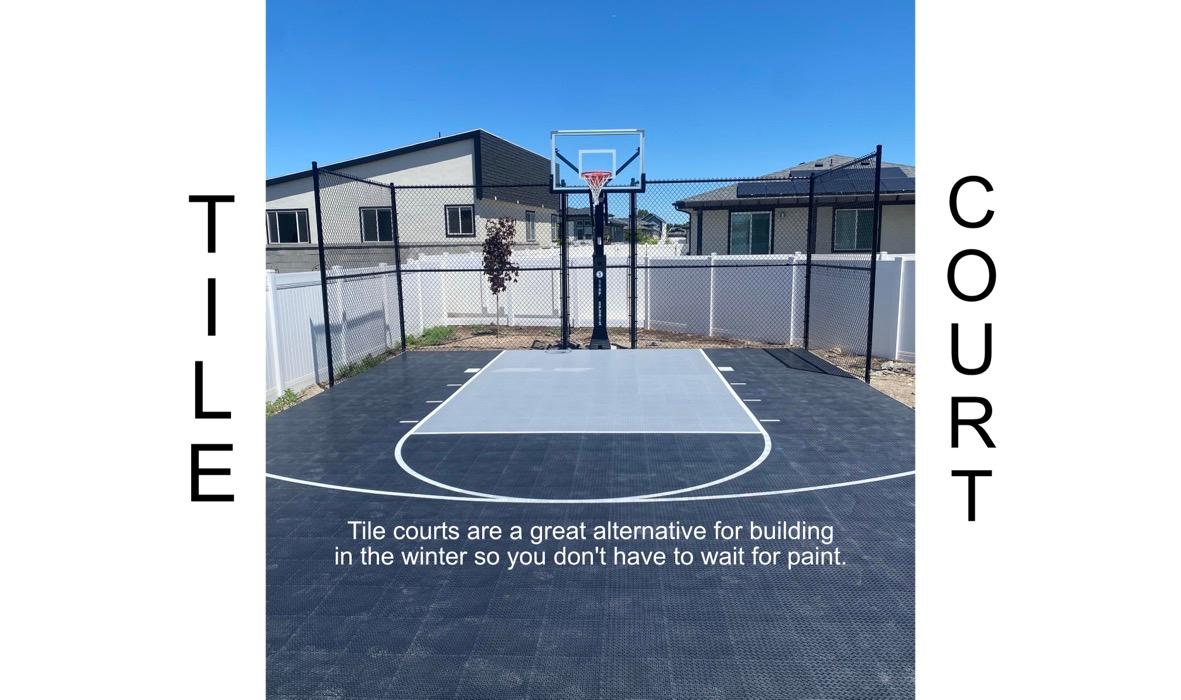 Tiled basketball sport court in Spanish Fork, interlocking polymer tiles with pre-painted lines.