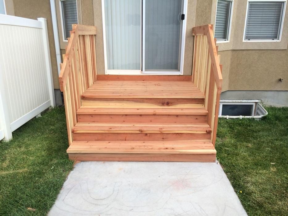 The Spanish Fork timber staircase seen square on, showing the landing at the top and the stair treads down to the walk.