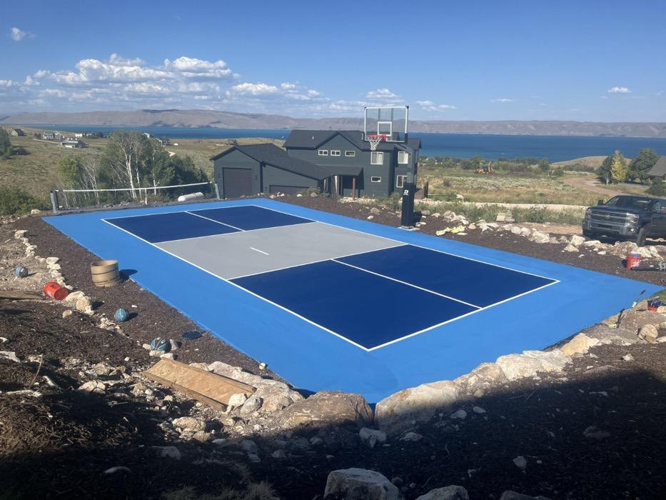 Freshly painted pickleball and basketball court above the east side of Bear Lake.