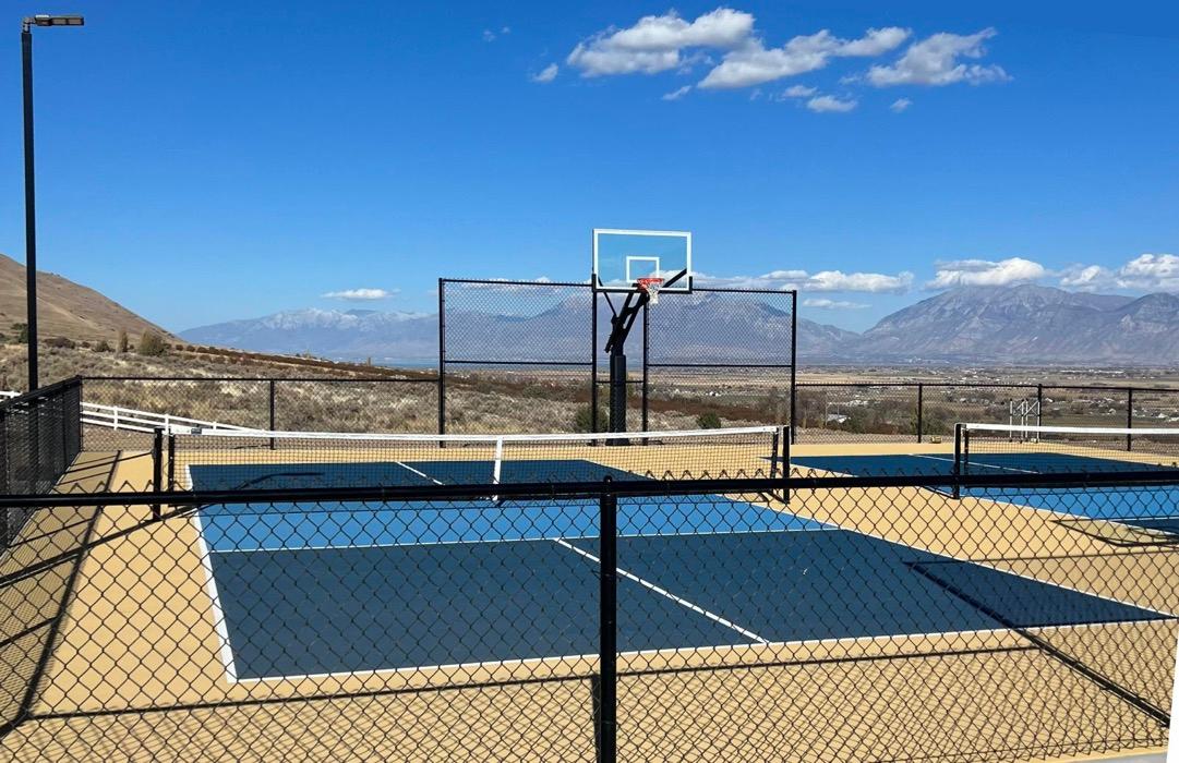Double pickleball and basketball court in Payson in sand dune and blue, looking out over the valley from West Mountain.