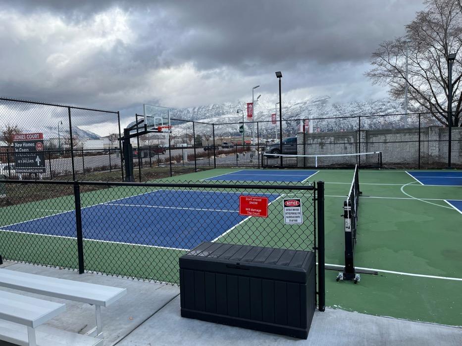 Multi-sport court in Provo striped for both pickleball and basketball.