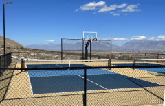 Multi-Sport Court Construction in Payson, Utah with Pickleball and Basketball with blue and sandune colors and a skyline view of the valley built by Courts Utah your premiere multi-sport court construction company.